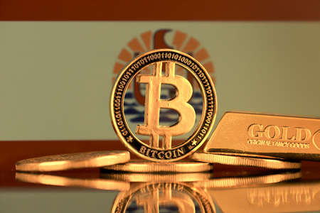 Physical version of Bitcoin, gold bar and French Polynesia Flag.の写真素材