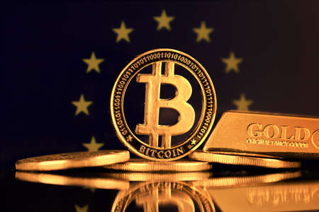 Physical version of Bitcoin, gold bar and European Union Flag.の写真素材