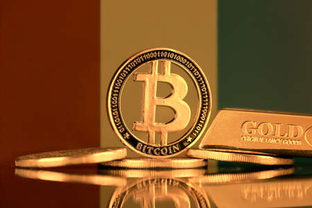 Physical version of Bitcoin, gold bar and Guinea Flag.の写真素材
