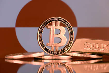 Physical version of Bitcoin, gold bar and Greenland Flag.の写真素材