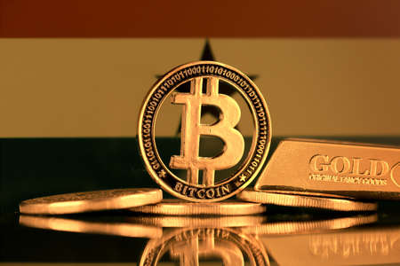 Physical version of Bitcoin, gold bar and Ghana Flag.の写真素材