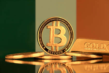 Physical version of Bitcoin, gold bar and Ireland Flag.の写真素材