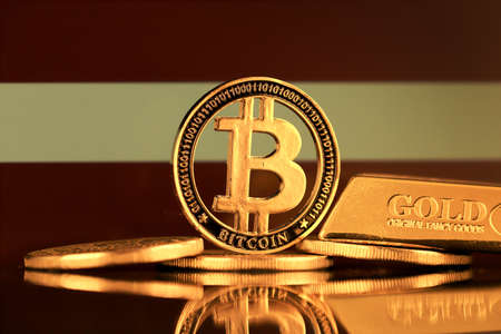 Physical version of Bitcoin, gold bar and Latvia Flag.の写真素材