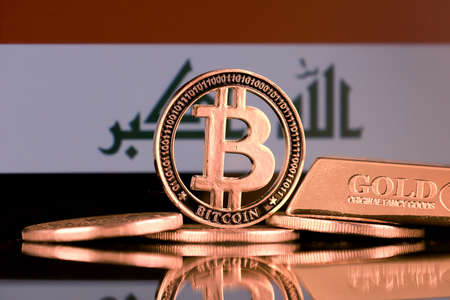 Physical version of Bitcoin, gold bar and Iraq Flag.の写真素材