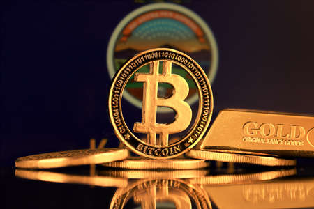 Physical version of Bitcoin, gold bar and Kansas State Flag.の写真素材