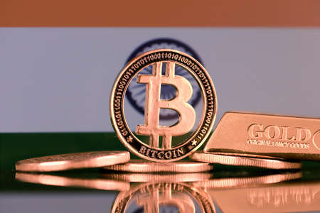Physical version of Bitcoin, gold bar and India Flag.の写真素材