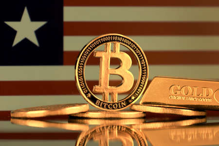 Physical version of Bitcoin, gold bar and Liberia Flag.の写真素材