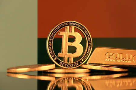 Physical version of Bitcoin, gold bar and Madagascar Flag.の写真素材