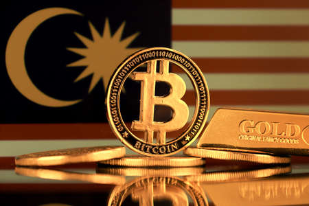 Physical version of Bitcoin, gold bar and Malaysia Flag.の写真素材