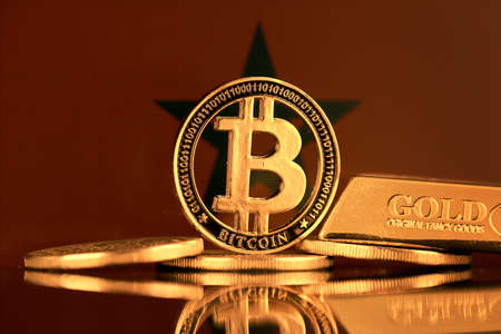 Physical version of Bitcoin, gold bar and Morocco Flag.の写真素材