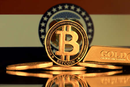 Physical version of Bitcoin, gold bar and Missouri State Flag.の写真素材