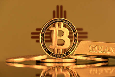 Physical version of Bitcoin, gold bar and New Mexico State Flag.の写真素材