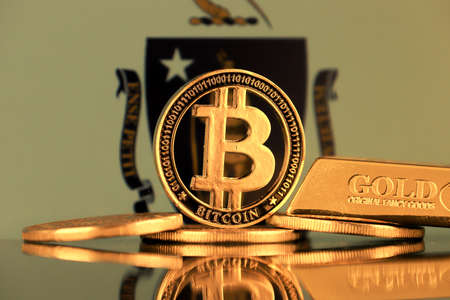 Physical version of Bitcoin, gold bar and Massachusetts State Flag.の写真素材