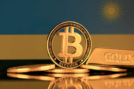 Physical version of Bitcoin, gold bar and Rwanda Flag.の写真素材