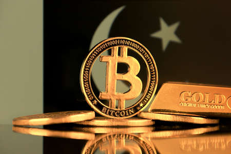 Physical version of Bitcoin, gold bar and Pakistan Flag.の写真素材
