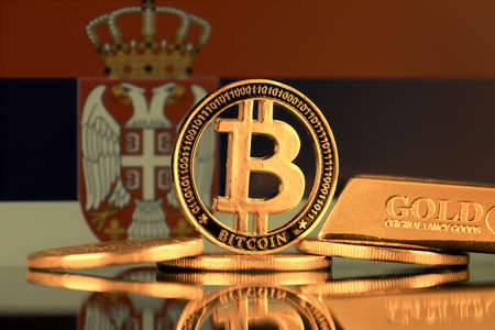 Physical version of Bitcoin, gold bar and Serbia Flag.の写真素材