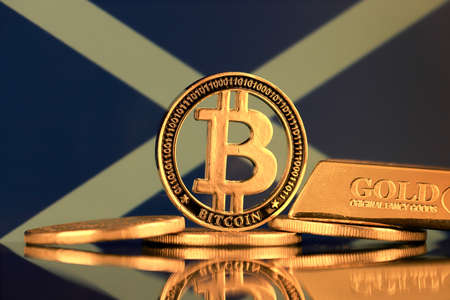 Physical version of Bitcoin, gold bar and Scotland Flag.の写真素材