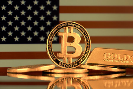 Physical version of Bitcoin, gold bar and United States Flag.