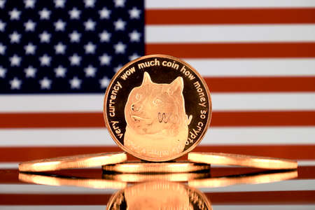 A physical version of Dogecoin (Cryptocurrency) and United States Flag.の写真素材