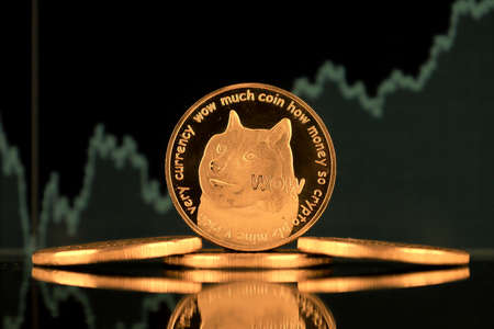 A physical version of Dogecoin (Cryptocurrency). A conceptual image for investors in the fast-growing cryptocurrency and blockchain technology market.の写真素材
