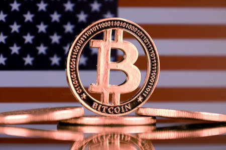 Physical version of Bitcoin and United States Flag.の写真素材