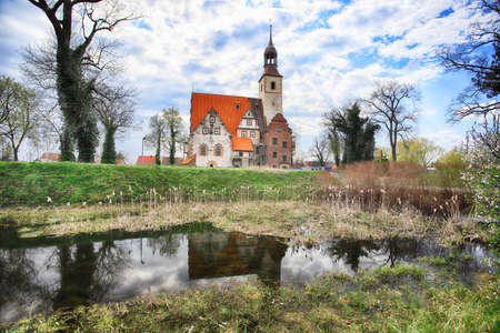 WROCLAW, POLAND - APRIL 21, 2021: Roman Catholic Church of st. Trinity (17th century, 1597-1602) situated on a small island in the river in Zorawina near Wroclaw, Poland.のeditorial素材