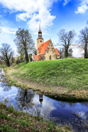 WROCLAW, POLAND - APRIL 21, 2021: Roman Catholic Church of st. Trinity (17th century, 1597-1602) situated on a small island in the river in Zorawina near Wroclaw, Poland.のeditorial素材