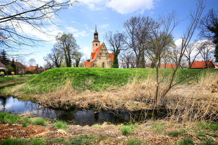 WROCLAW, POLAND - APRIL 21, 2021: Roman Catholic Church of st. Trinity (17th century, 1597-1602) situated on a small island in the river in Zorawina near Wroclaw, Poland.のeditorial素材
