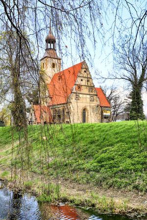 WROCLAW, POLAND - APRIL 21, 2021: Roman Catholic Church of st. Trinity (17th century, 1597-1602) situated on a small island in the river in Zorawina near Wroclaw, Poland.のeditorial素材