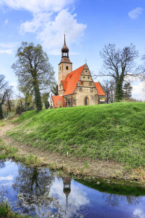 WROCLAW, POLAND - APRIL 21, 2021: Roman Catholic Church of st. Trinity (17th century, 1597-1602) situated on a small island in the river in Zorawina near Wroclaw, Poland.のeditorial素材