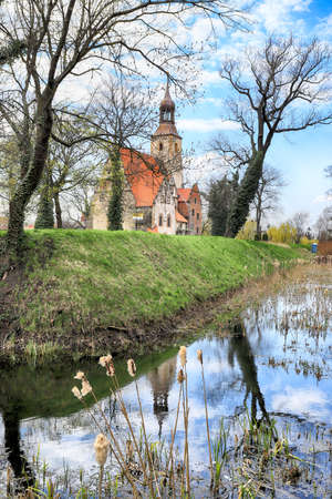 WROCLAW, POLAND - APRIL 21, 2021: Roman Catholic Church of st. Trinity (17th century, 1597-1602) situated on a small island in the river in Zorawina near Wroclaw, Poland.のeditorial素材