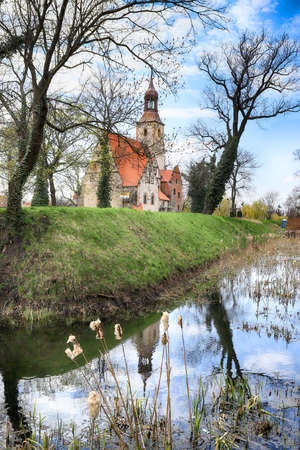 WROCLAW, POLAND - APRIL 21, 2021: Roman Catholic Church of st. Trinity (17th century, 1597-1602) situated on a small island in the river in Zorawina near Wroclaw, Poland.のeditorial素材