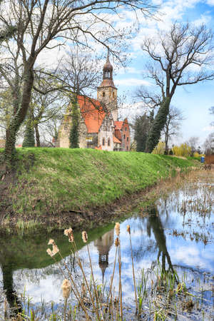 WROCLAW, POLAND - APRIL 21, 2021: Roman Catholic Church of st. Trinity (17th century, 1597-1602) situated on a small island in the river in Zorawina near Wroclaw, Poland.のeditorial素材