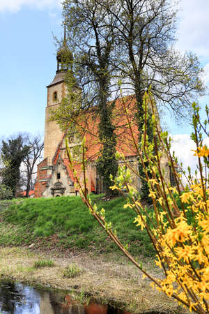 WROCLAW, POLAND - APRIL 21, 2021: Roman Catholic Church of st. Trinity (17th century, 1597-1602) situated on a small island in the river in Zorawina near Wroclaw, Poland.のeditorial素材