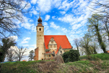 WROCLAW, POLAND - APRIL 21, 2021: Roman Catholic Church of st. Trinity (17th century, 1597-1602) situated on a small island in the river in Zorawina near Wroclaw, Poland.のeditorial素材