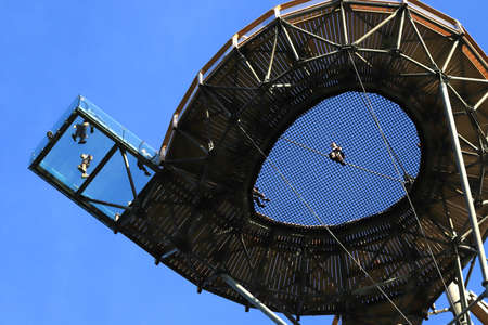 SWIERADOW-ZDROJ, POLAND - JUNE 05, 2021: Sky Walk in Swieradow-Zdroj, the highest observation tower in Poland (mesh and glass platform 62 meters above the ground).のeditorial素材