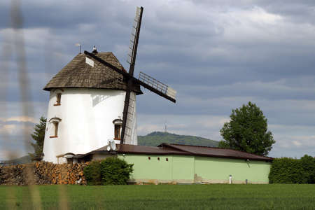 WROCLAW, POLAND - MAY 24, 2021: Dutch windmill from 1830 located on the edge of the village of Gogolow at the foot of the Sleza Mountain, in south-western Poland, Europe.のeditorial素材