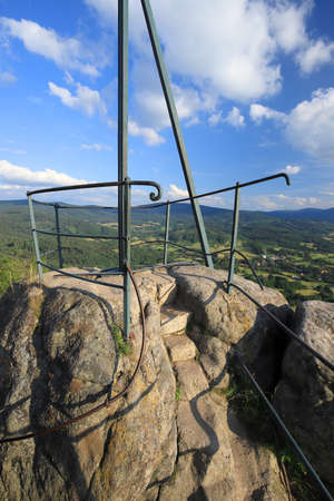 Krzyzna Gora (654 m above sea level) in the area of Rudawy Janowickie (Mountains in south-west Poland, Europe). There are steps carved in the rock to the top (black trail).の写真素材
