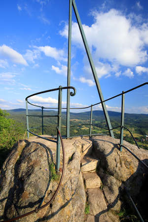 Krzyzna Gora (654 m above sea level) in the area of Rudawy Janowickie (Mountains in south-west Poland, Europe). There are steps carved in the rock to the top (black trail).の写真素材