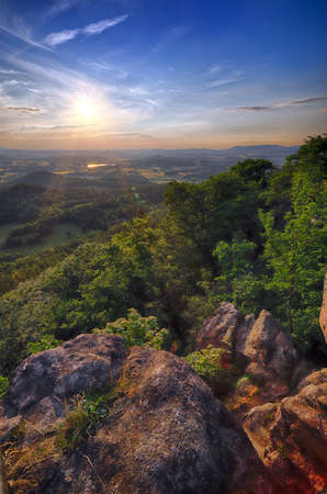 Beautiful sunset and clouds in Rudawy Janowickie (Mountains in south-west Poland, Europe). View from Krzyzna Gora (654 m above sea level) in the middle of July.の写真素材