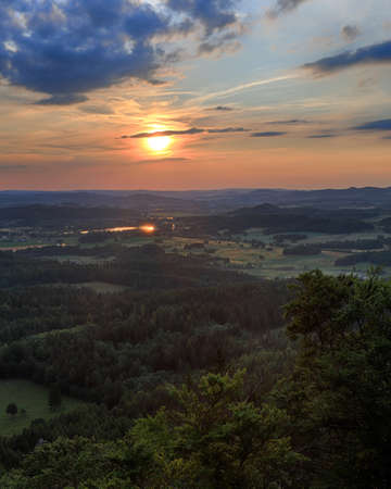 Beautiful sunset and clouds in Rudawy Janowickie (Mountains in south-west Poland, Europe). View from Krzyzna Gora (654 m above sea level) in the middle of July.の写真素材