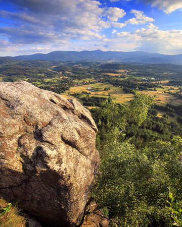 Krzyzna Gora (654 m above sea level) in the area of Rudawy Janowickie (Mountains in south-west Poland, Europe). There are steps carved in the rock to the top (black trail).の写真素材