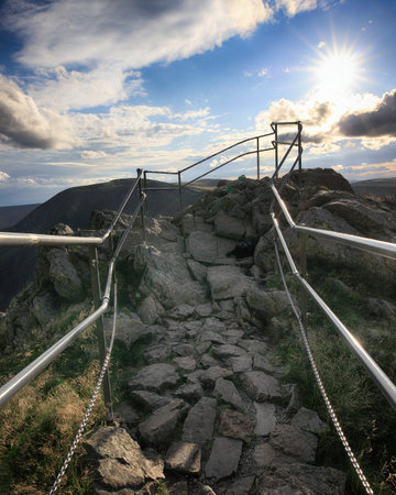 Tourist trail to the top of Sniezka during the golden hour. Mountain on the border between the Czech Republic and Poland.の写真素材