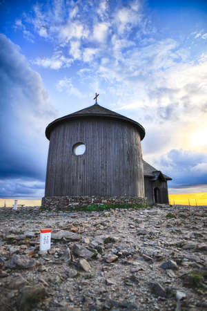 St. Lawrence's Chapel on the top of Snezka or Sniezka (in Czech and Polish) during sunset. Mountain on the border between the Czech Republic and Poland.の写真素材