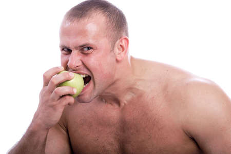 MUSCULAR MAN. ISOLATED ON WHITE. SHOT IN STUDIO.の写真素材
