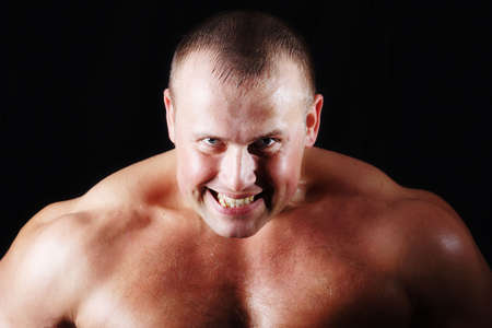 MUSCULAR MAN. ISOLATED ON BLACK. SHOT IN STUDIO.の写真素材