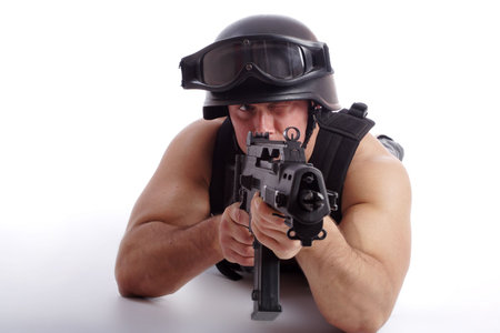 Shot of a soldier holding gun. Uniform conforms to special services(soldiers) of the NATO countries....