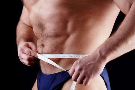 MUSCULAR MAN. ISOLATED ON BLACK. SHOT IN STUDIO.の写真素材