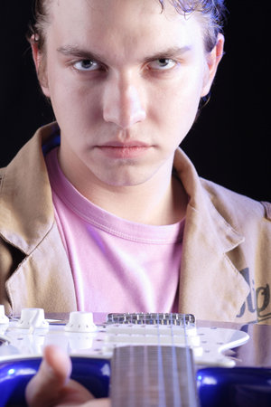 Portrait of a styled professional model. Theme: teens, music.
