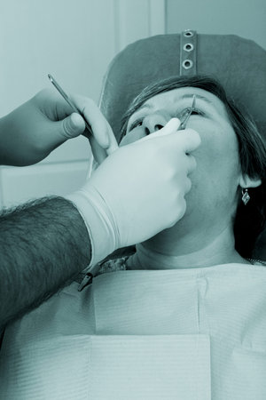 Dental background: work in clinic (operation, tooth replacement)
の写真素材